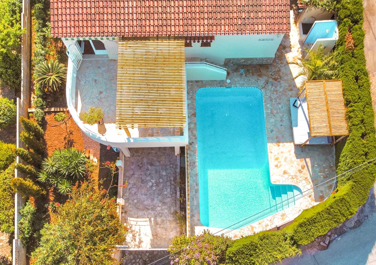 Aerial view of a Mediterranean house with pool and wooden pergola in Denia/Montgó.